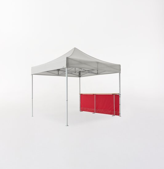 Ecotent® pop-up gazebo with red half-height sidewall and wooden counter.